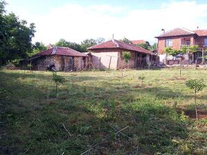 A two-story house with a yard in the village of Mramor