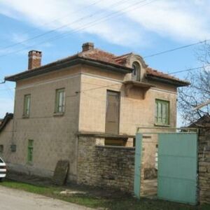 Two-storey, with a garage. It is located in a village about 