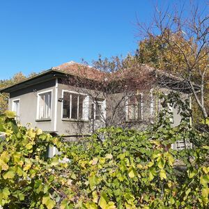 Solid house with barn and land in a village near big river