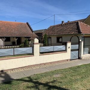 Three-room house with a large commercial building and garage